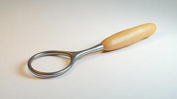 Modern, metallic magnifying tool with a wooden handle. photo