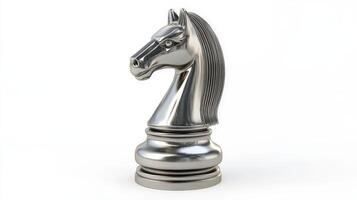Polished silver chess knight piece against white background. photo