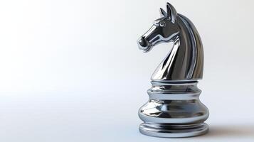 Polished, chrome chess knight piece, solitary figure against a plain backdrop. photo