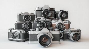 Vintage cameras stacked in a still life display. photo