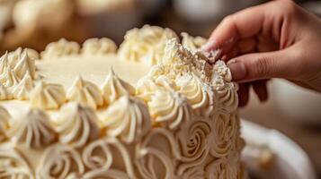 Detailed view of a cake decorated with buttercream roses. photo