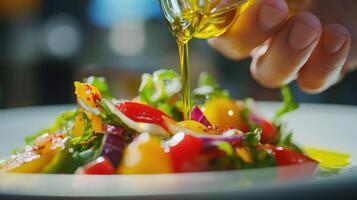 Close-up of olive oil being poured onto a vibrant salad. photo