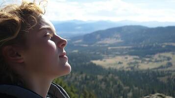 A young person's peaceful contemplation of a scenic landscape. photo
