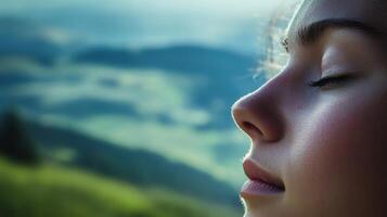 Close-up portrait of a peaceful young woman in nature. photo