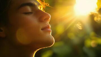 Close-up profile view of a person, bathed in golden sunlight. photo