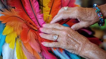 Hands carefully arranging vibrant colorful feathers. photo