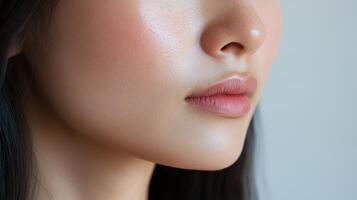 Close-up profile view of a person's face with flawless skin. photo
