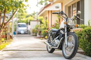 Stylish Motorcycle parked in front of a house in a quiet neighborhood photo