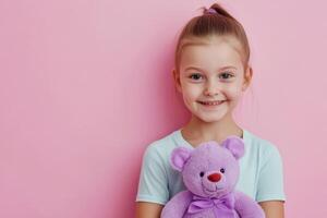 Smiling Girl with Teddy Bear on Pink Background 2 photo