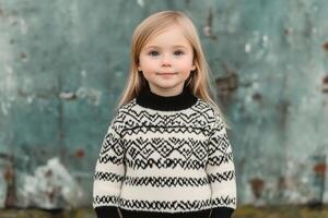 Adorable Little Girl in a Stylish Knitted Sweater photo