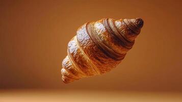 A Delectable Croissant, Perfectly Golden Brown and Flaky, a Perfect Morning Treat. A Culinary Masterpiece of Baked Delights, a Golden Spiral of Flavor, Ready to Indulge Your Senses. photo