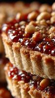 of a Stacked Tart with Jam and Nuts A Sweet and Scrumptious Dessert photo