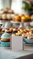 A table with cupcakes and other desserts photo