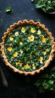 A quiche with eggs and spinach on a table photo