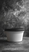 A black and white photo of a plastic container