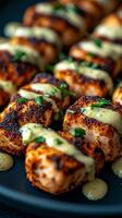 view of perfectly grilled salmon cubes, seasoned and adorned with a creamy herb sauce. This delectable dish is a culinary masterpiece, ideal for a gourmet dinner or elegant appetizer. photo
