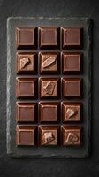 A Luxurious Dark Chocolate Bar Indulge in the Richness and Smoothness of this Exquisite Treat. Perfect for satisfying your sweet cravings and elevating your moments of pure bliss. photo