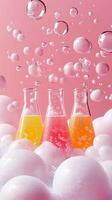Three Colorful Fizzy Drinks in Erlenmeyer Flasks Surrounded by Bubbles and Foam on a Pink Background. A Refreshing Summer Beverage photo