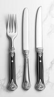 Exquisite Silver Cutlery Set A Symphony of Elegance and Luxury. This image showcases a meticulously crafted three piece cutlery se photo