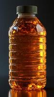 A captivating shot of an amber colored beverage in a plastic bottle, showcasing its refreshing qualities and vibrant color. The i photo