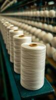 Precisely Wound Threads A Glimpse into the Textile Industrys Intricate Manufacturing Process. Rows of Yarn Spools Showcase the Ski photo