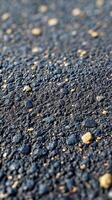 A captivating revealing the intricate texture of dark stones, pebbles, and gravel. The image showcases a detailed view of the nat photo