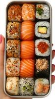 A delightful assortment of assorted sushi, showcasing the vibrant colors and textures of various fish, rice, and other ingredients photo