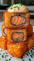 A plate topped with sushi and salmon photo