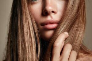 portrait of a woman with long, shiny blonde hair. Her healthy, glowing skin and elegant style create a stunning and sensual image. photo