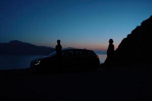 Serene Evening Road Trip A Couples Scenic Drive at Sunset, Enjoying the Breathtaking Ocean and Mountain Views. A Journey of Explor photo