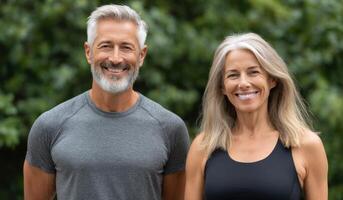 Portrait of a Happy, Healthy Couple Enjoying an Active Lifestyle Outdoors. Smiling man and woman, middle aged, with gray hair, ex photo