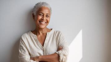 Portrait of a Happy Senior Woman with Gray Hair and a Confident Smile. A Captivating Image Showcasing Beauty, Elegance, and Posit photo