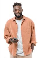 A Happy Man Smiling While Using His Mobile Phone. A Portrait of a Content African American Male in Casual Fashion, Set Against a photo