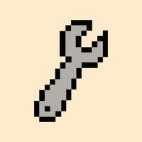 Retro 8-bit wrench icon on creamy peach pixel background vector
