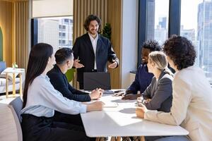 Caucasian man sale manager is presenting new project to colleagues in executive meeting for next year plan with market share increase for global business and investment photo