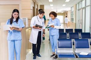 Team of diversity doctor and nurse is discussing and brainstorming on patient medical record after diagnosis for precise care plan with experience senior physician specialist photo