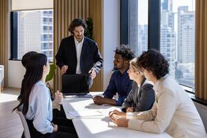 Caucasian man sale manager is presenting new project to colleague in executive meeting for next year plan with market share increase for global business and investment photo