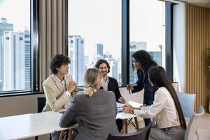 African woman sale manager is showing annual report chart to the colleagues in the executive meeting for next year plan with market share increase for global business and investment photo