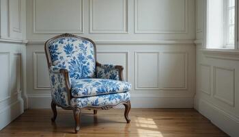 Elegant Blue Floral Chair Positioned in a Well-Lit Corner of a Classic Room Setting photo