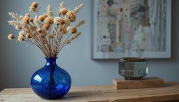 Blue Vase With Dried Flowers on Wooden Table in Modern Interior Setting photo