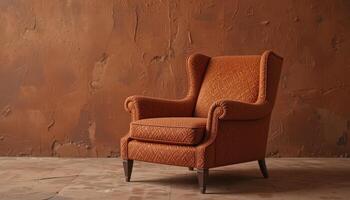 Elegant Orange Armchair Resting Against a Textured Brown Wall in a Cozy Indoor Setting photo