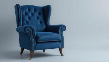 Elegant Blue Armchair With Tufted Backrest Placed Against a Minimalist Light Gray Background photo
