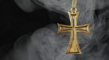 Christian Religion Symbol Metallic Cross in Smoke Ambiance photo