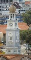 A clock tower with a clock on it photo