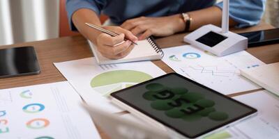Sustainable ESG strategy discussion with data analysis and charts photo