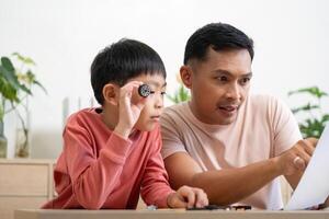 Activity of father and son engaging in hands-on learning with projects photo