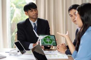 ESG Presentation. Team discussing environmental, social, and governance strategies in a collaborative setting. photo