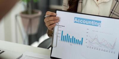 Accounting Insights and Data Analysis. Professional presenting financial charts and reports. photo