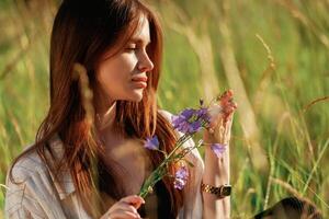 Beautiful young ,woman is on the field, countryside photo