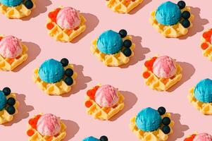 Seamless waffle pattern with pink and blue ice cream scoops and raspberries or blueberries on pastel pink background. Sweet and playful dessert themed texture for backgrounds or summer visuals. photo